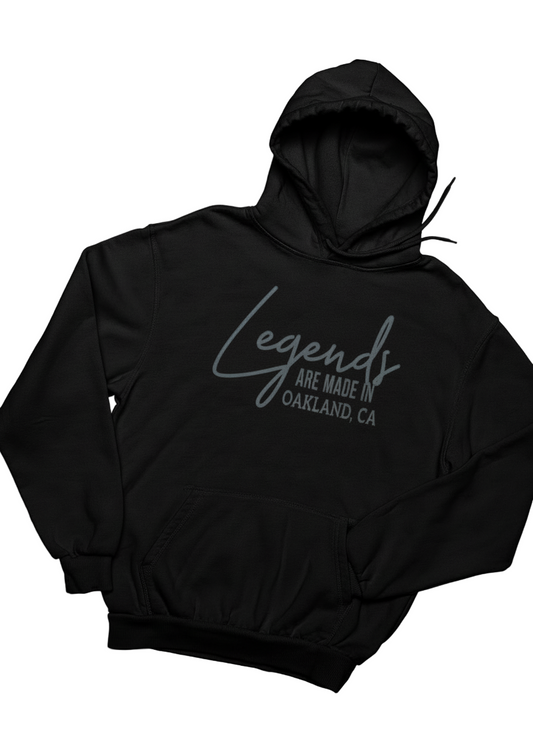 Black hoodie with 'Legends are made in Oakland, CA' text on a white background